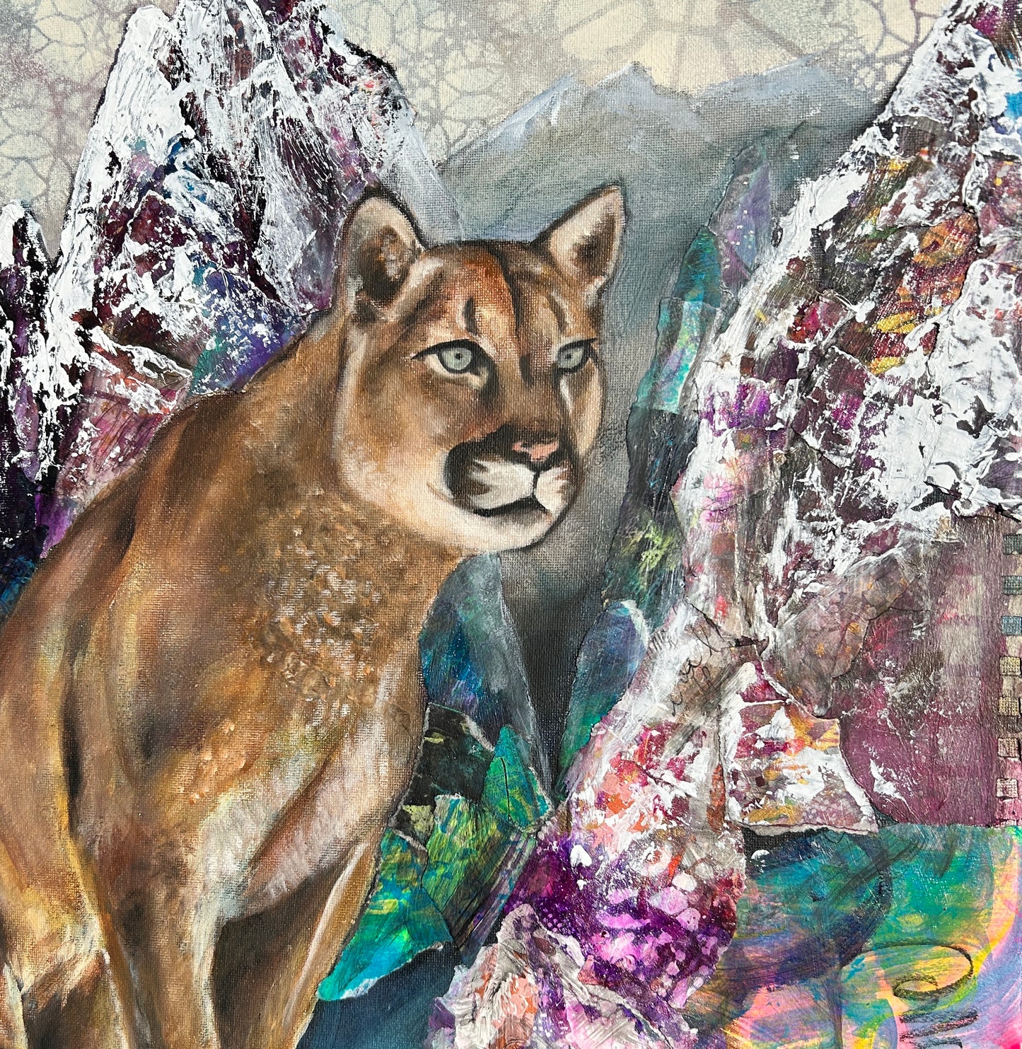 Collage of a mountain lion with colorful abstract elements